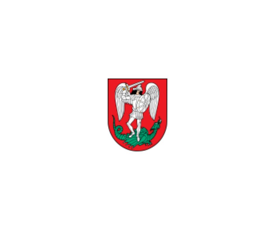 Coat of arms featuring a white eagle with outstretched wings on a red background, symbolizing strength and heritage.